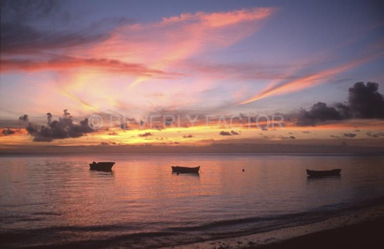 Sunset;colorful;sky;kadavu island fiji;clouds;water;blue water;yellow;boat;red;pink;sillouettes;blue;anchorages